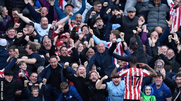 Ivan Toney celebrates in front of the Brentford fans