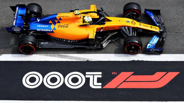 Lando Norris of McLaren drives past 1,000 track graphic