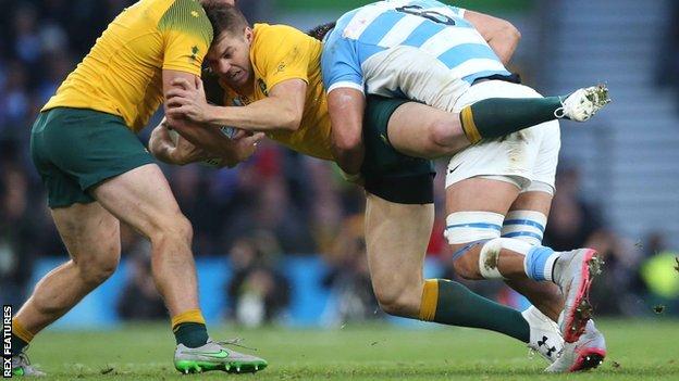 Australia's Drew Mitchell is tackled by Argentina flanker Pablo Matera