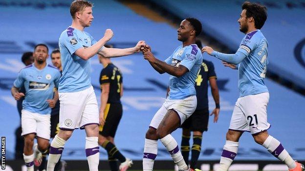 Players celebrate with Kevin de Bruyne