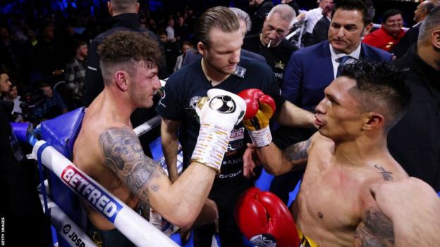 Mauricio Lara fistbumps Leigh Wood after their fight