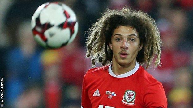 Ethan Ampadu watches the ball