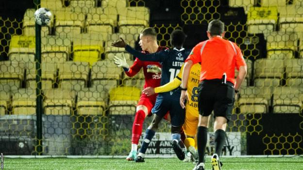 Livingston's Scott Pitman (partially blocked) scores to make it 1-1 during a cinch Premiership match between Livingston and Ross County at the Tony Macaroni Arena