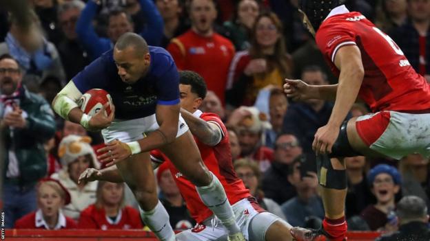 Gael Fickou bundles his way over the line to score for France against Wales