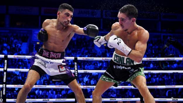 Michael Conlan evades the punch attempt from Jordan Gill during the WBA International Super Featherweight Title fight between Michael Conlan and Jordan Gill at The SSE Arena Belfast