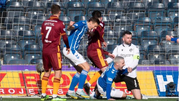 Scott Robinson scrambles in goal