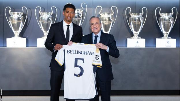 Jude Bellingham holds the Real Madrid shirt after joining the club