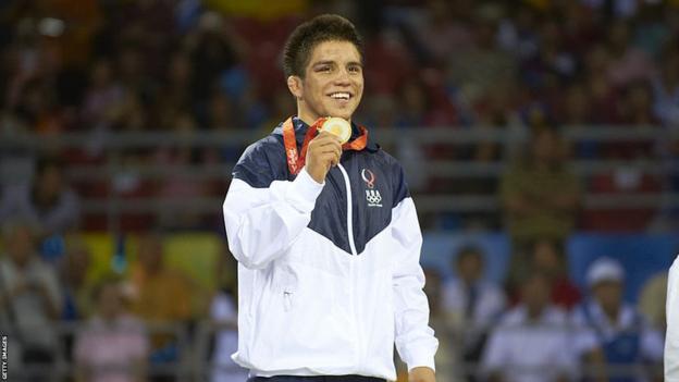 Henry Cejudo with his gold medal at the 2008 Beijing Olympics