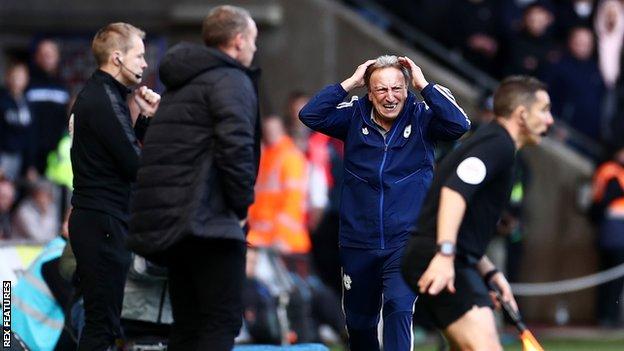 Cardiff boss Neil Warnock shows his frustration during their defeat away to rivals Swansea