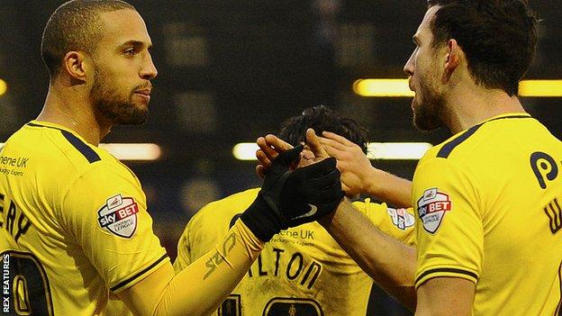 Jordan Bowery celebrates his debut goal for Oxford United