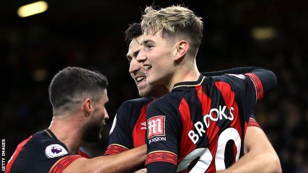 David Brooks celebrates with his team-mates after scoring for Bournemouth against Brighton