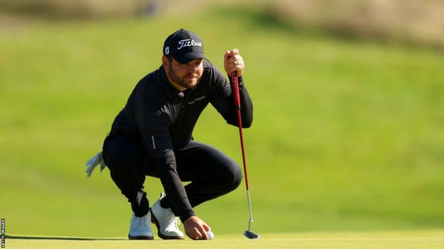 Jordan Smith sizes up a putt at the French Open