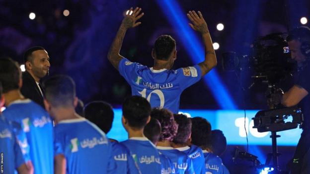Neymar waves to fans at his official unveiling as an Al-Hilal player