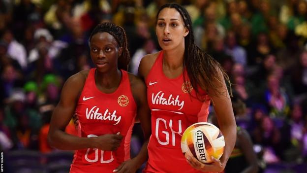 England goalkeeper Geva Mentor puts her arm around goal defence Funmi Fadoju during the Netball World Cup