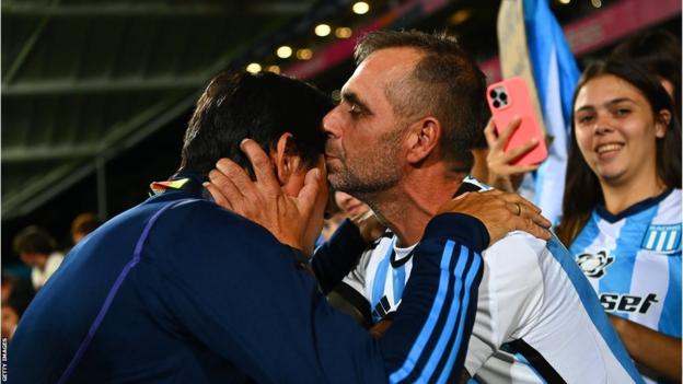 Argentina coach German Portanova is kissed by a fan during a match against New Zealand in February 2023