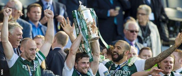 Hibernian players celebrate with the Scottish Cup