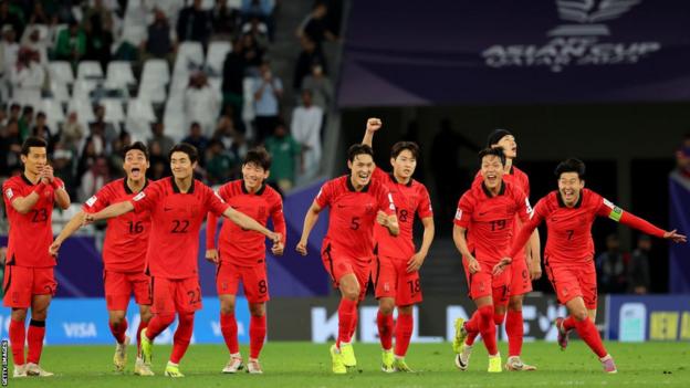 South Korea's players celebrate after the decisive penalty in their shootout victory over Saudi Arabia is scored by Cho Gue-sung