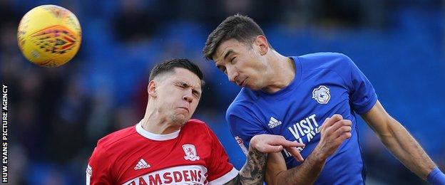 Marco Grujic beats Middlesbrough's Humamed Besic in the air