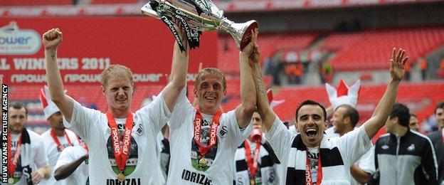 Alan Tate (left), Garry Monk and Leon Britton celebrate Swansea's 2011 Championship play-off final victory against Reading