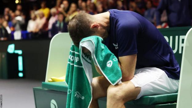 Andy Murray sobs into his towel during the Davis Cup tie with Switzerland