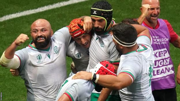 Portugal's Nicolas Martins (second left) celebrates his team's first try