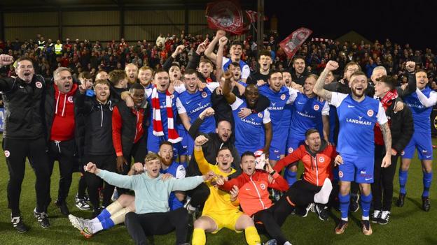 Larne celebrate winning the league title