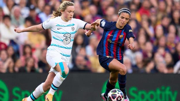 Erin Cuthbert and Aitana Bonmati duel for the ball in midfield