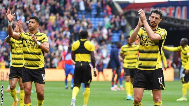 Watford players applaud the fans after losing to Crystal Palace