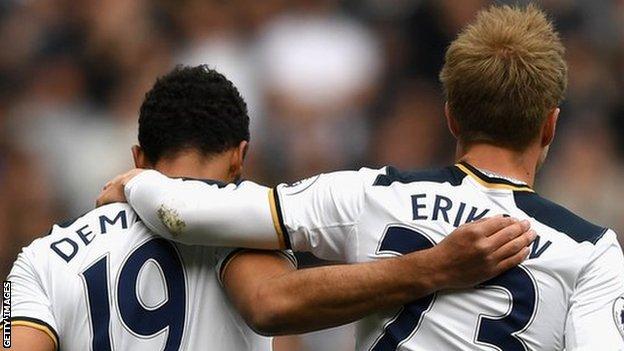 Mousa Dembele hugs Christian Eriksen