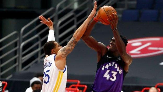 Toronto Raptors' Pascal Siakam goes up for a shot against the Golden State Warriors' Juan Toscano-Anderson