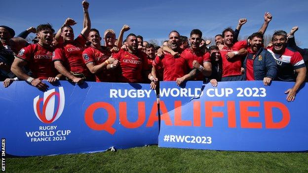 Spain celebrate with a sign saying Rugby World Cup 2023 qualified