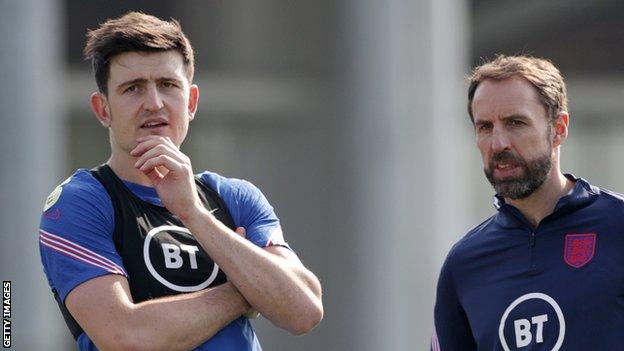 Harry Maguire and Gareth Southgate during an England training session