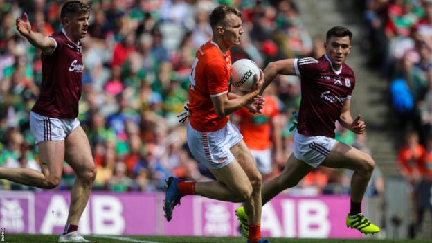 Galway's Shane Walsh is unable to keep pace with Armagh's Rian O'Neill in last year's All-Ireland quarter-final at Croke Park