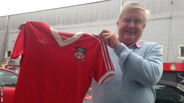Dixie McNeil holds his old Wrexham shirt