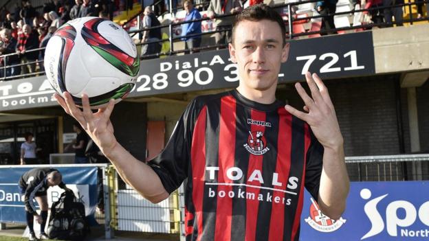 Paul Heatley scored four goals in Crusaders' 5-0 victory over Carrick which kept them within four points of leaders Linfield