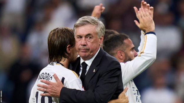 Real Madrid manager Carlo Ancelotti hugs Luka Modric after a Real Madrid match