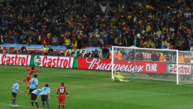 Gyan's penalty skims off the top of the bar