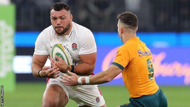 England's Ellis Genge runs towards Australia's Nic White