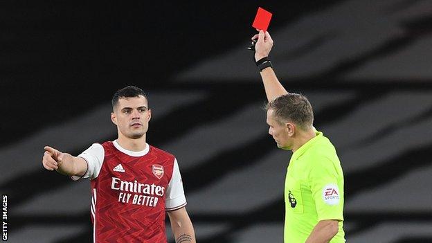 Granit Xhaka being shown a red card