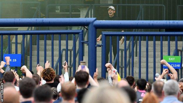 Kalvin Phillips celebrates promotion to the Premier League with Leeds fans at Elland Road