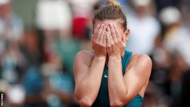 Simona Halep covers her eyes after sealing victory