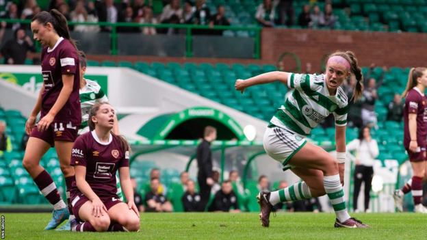 Celtic's Caitlin Hayes (R) after scoring to make it 1-0 during a Scottish Women's Premier League match between Celtic and Heart of Midlothian at Celtic Park