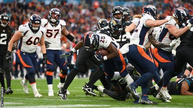 Melvin Gordon scores a touchdown for the Denver Broncos