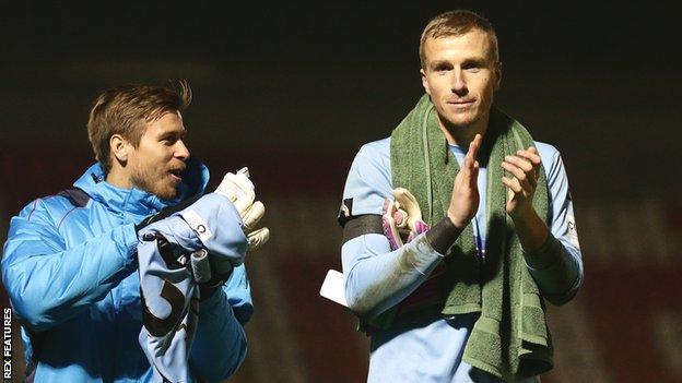 Elliot Justham (right) applauds the Dagenham fans after they beat AFC Fylde