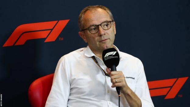 Stefano Domenicali speaking at a news conference