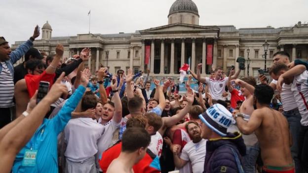 England fans celebrate after the UEFA Euro 2020 round of 16 match between England and Germany at the Trafalgar Square Fan Zone in London