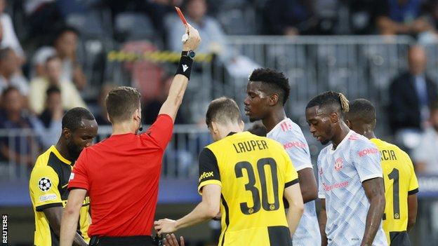 Aaron Wan-Bissaka is shown the red card during Manchester United's Champions League group game against Young Boys