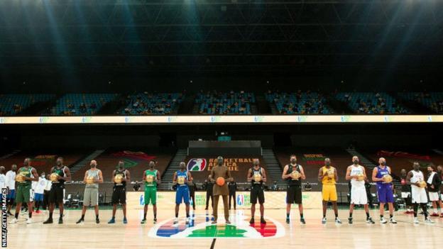 Basketball Africa League president Amadou Gallo Fall (centre) with the captains of the 12 teams taking part in the inaugural league