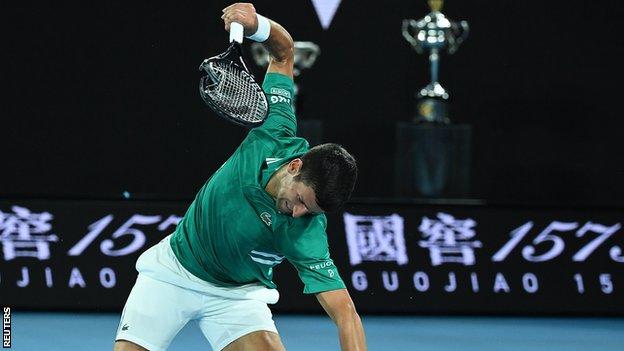 Novak Djokovic broke his racket late in the third set