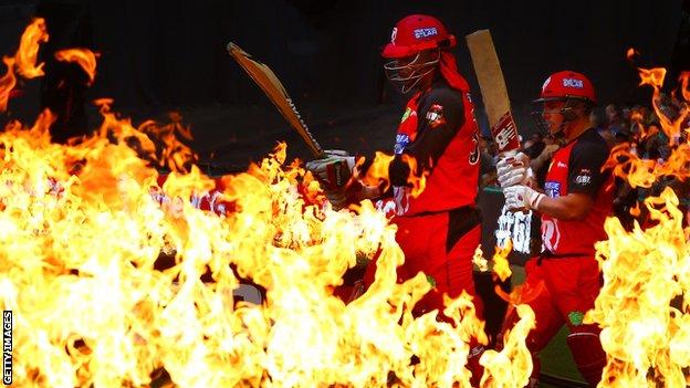Chris Gayle and Aaron Finch walk out to bat